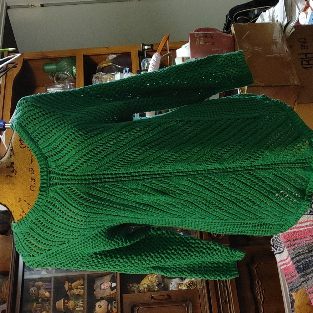 Green crochet sweater with black sweater leggings